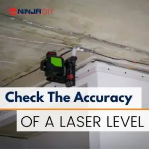 a laser level hanging on the ceiling whilst the builder is checking for its accuracy