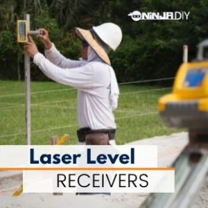 a construction worker using a laser level device and a laser level receiver to set up levels